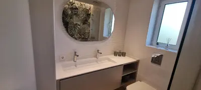 a bathroom with a sink and a mirror at T2 Marina Vilamoura in Quarteira