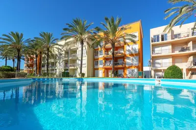 a swimming pool in a yard with trees at BnB Homes Apartment with cozy Terrace & 2 Swimming pools near the heart city in Albufeira