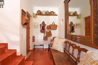 a room with a mirror and a bunch of bags on the wall at Villa Casa Pepa-Paca - Swiming Pool & Air Condition - Albufeira - Sesmarias - BY BEDZY in Albufeira