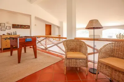 a living room with a desk and two chairs at Villa Casa Pepa-Paca - Swiming Pool & Air Condition - Albufeira - Sesmarias - BY BEDZY in Albufeira