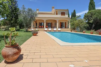 a house with a swimming pool in front of it at Villa Casa Pepa-Paca - Swiming Pool & Air Condition - Albufeira - Sesmarias - BY BEDZY in Albufeira
