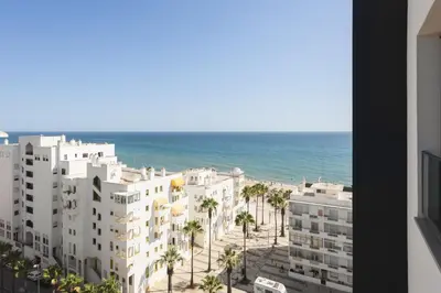 a view of the ocean from a building at Terracos de Quarteira -Luxury Duplex Penthouse 3BR Best View, 50m from Beach in Quarteira