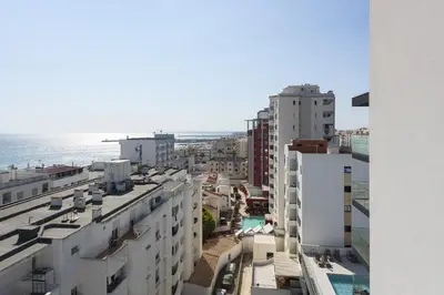 an aerial view of a city with buildings and the ocean at Terracos de Quarteira -Luxury Duplex Penthouse 3BR Best View, 50m from Beach in Quarteira
