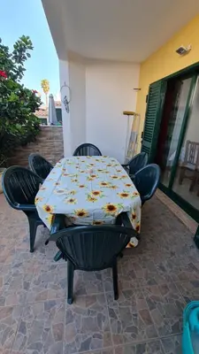 a table and chairs sitting on a patio at Villa V3 - Vale Pedras in Albufeira
