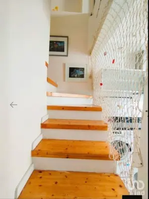 a stairway with white steps and a white railing at Cozy House in Center in Faro