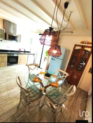 a glass table and chairs in a kitchen at Cozy House in Center in Faro