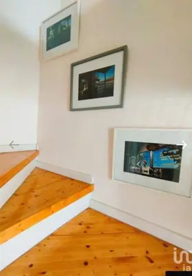 a room with two framed pictures on the wall at Cozy House in Center in Faro