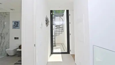 a hallway with a door leading to a bathroom at Villa Malibu - Onesix2, Cleverdetails CD 285 in Vilamoura