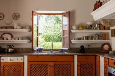 a kitchen with a sink and a window at Almancil Sea and Countryside Secluded Villa in Quartos