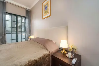 a bedroom with a bed and a window at Calm Paradise close to the City in Faro