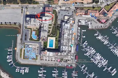 a map of a marina with a red circle at VilamouraSun Aquamar Penthouse 601 in Quarteira