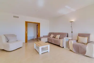 a living room with two couches and a coffee table at Apartamento Al Sakia 2bdr com piscina e ar condicionado in Quarteira