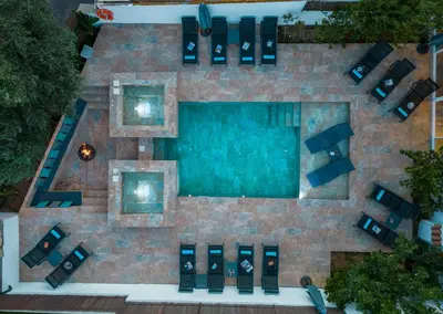 an overhead view of a swimming pool with chairs and a table at Villa Palancar by Algarve Vacation in Albufeira