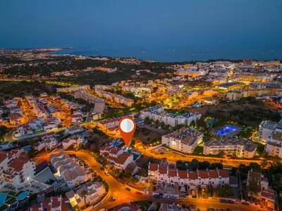an aerial view of a city at night at Villa Palancar by Algarve Vacation in Albufeira