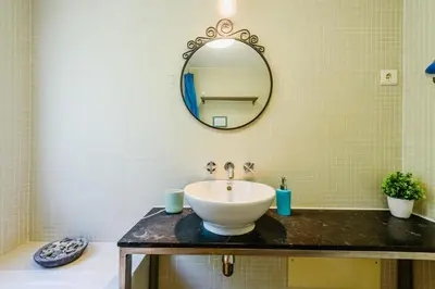 a bathroom with a sink and a mirror at Villa 715 - our Albufeira holiday retreat in Albufeira