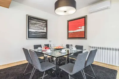a dining room with a table and chairs at Villa Malibu Marina in Albufeira