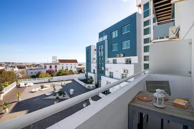 a view of a city from the roof of a building at Bay View Albufeira in Albufeira