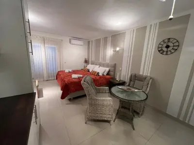 a room with a door leading to a bedroom at Paulos Studio in Faro