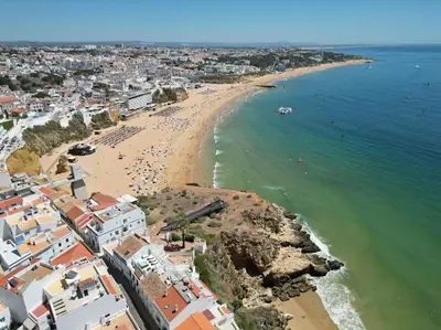 an aerial view of a beach with a group of people at Rossio Mar II - Albufeira in Albufeira