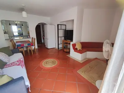 a living room with a couch and a table at Albufeira, T1 in Balaia Golf Village, Algarve in Albufeira