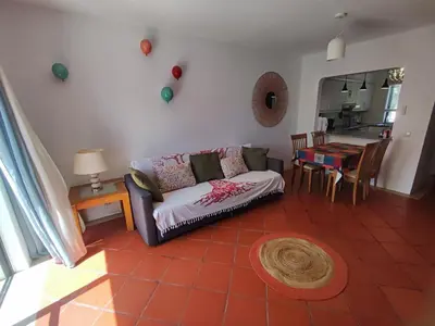 a living room with a couch and a table at Albufeira, T1 in Balaia Golf Village, Algarve in Albufeira