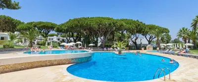 a bedroom with a bed with a large window at Albufeira, T1 in Balaia Golf Village, Algarve in Albufeira