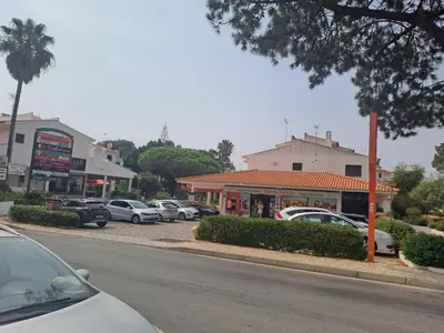 a group of cars parked in a parking lot at Praia da Falésia, O Melhor Estúdio da Aldeia das Acoteias in Albufeira