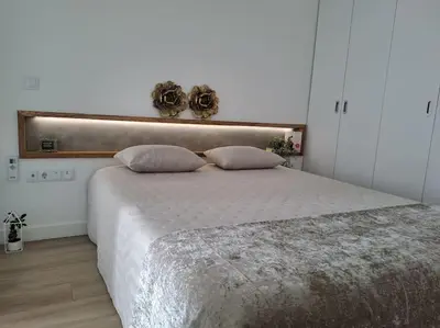 a bedroom with a large bed with two pillows at Praia da Falésia, O Melhor Estúdio da Aldeia das Acoteias in Albufeira