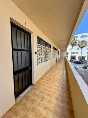 a view of the beach from the balcony of a building at Espadarte Quarteira Balcony Flat in Quarteira