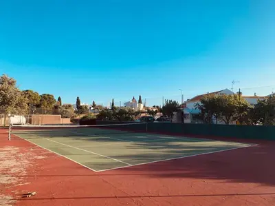 a tennis court on a tennis court at Vila Rafaella - Praia de São Rafael in Sesmarias