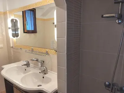 a bathroom with a sink and a shower at Quinta dos Amigos in Almancil