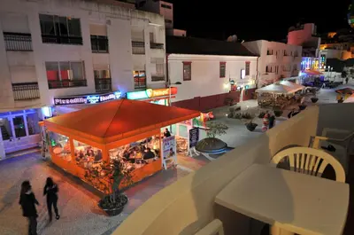 an overhead view of a food court in a city at night at Casas Barulho Apartment Old Town in Albufeira