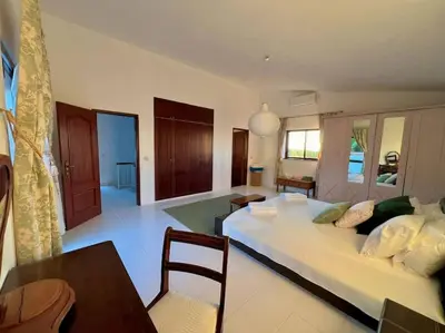 a large living room with a large white couch at Casa de Limoeiro - Countryside Villa in Córregos de Santa Luzia