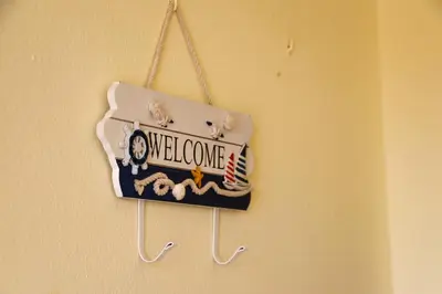 a welcome sign is hanging on a wall at Apartamento Perto da Praia Albufeira in Albufeira