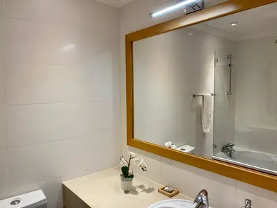 a bathroom with a sink and a mirror at Fantastic view over the sea in Albufeira