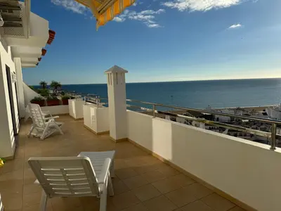 a balcony with chairs and a view of the ocean at Fantastic view over the sea in Albufeira