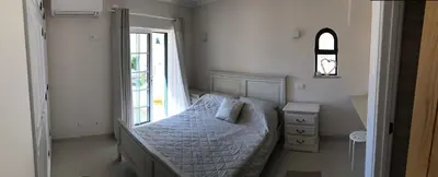 a small bedroom with a bed and a window at 4 Bedroom Villa with Heated Pool close to Old Village in Vilamoura