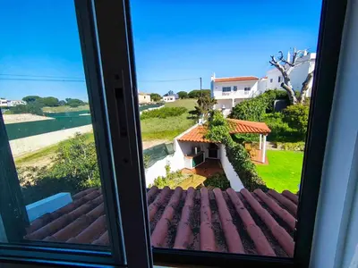 a view of a house from a window at Albufeira INN - Mulatinho V2 in Olhos de Água