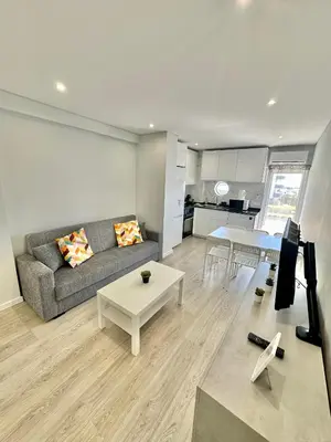 a living room with a couch and a table at Julio Apartment in Albufeira