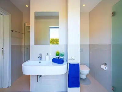 a bathroom with a sink and a toilet at Apartment Pine Hills Diamante-12 by Interhome in Vilamoura