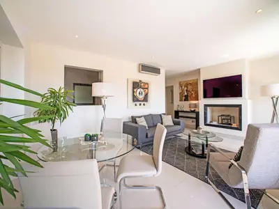 a living room with a couch and a table at Apartment Pine Hills Diamante-12 by Interhome in Vilamoura