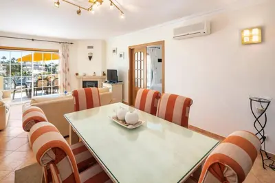 a dining room with a table and chairs at Lovely 2-Bed Apartment in Sao Rafael in Albufeira