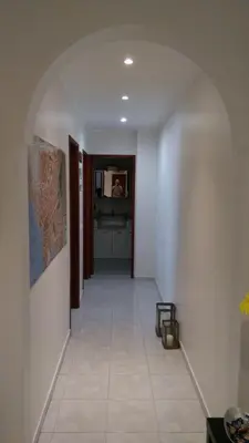 a hallway with an archway in a house at Faro Stadium Flat by Freetimealgarve in Faro