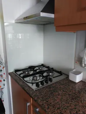 a stove top oven in a small kitchen at Faro Stadium Flat by Freetimealgarve in Faro