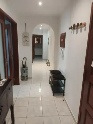 a hallway with a hallway leading to a room at Faro Stadium Flat by Freetimealgarve in Faro