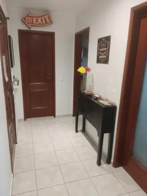 a hallway with a black desk and a door at Faro Stadium Flat by Freetimealgarve in Faro