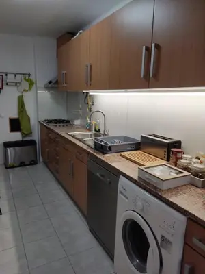 a kitchen with a dishwasher and a washing machine at Faro Stadium Flat by Freetimealgarve in Faro