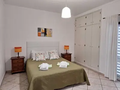 a white bathroom with a toilet and a sink at Villa Jorge by Ecovillas Albufeira in Galé