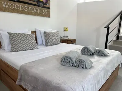 a bedroom with a bed with towels on it at Ocean view by Charmes Penthouse in Albufeira
