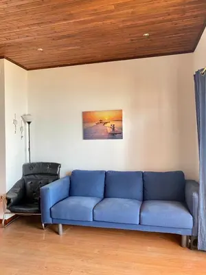 a room with a table and a chair and a shelf at Casa da Ria in Faro